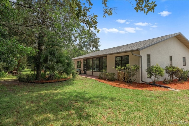 exterior space with a lawn