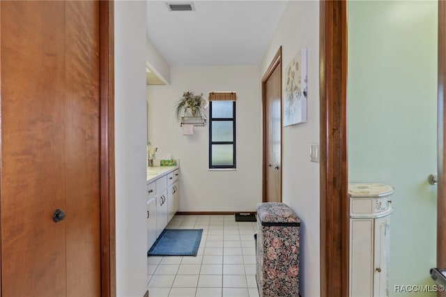 bathroom with tile patterned flooring and vanity