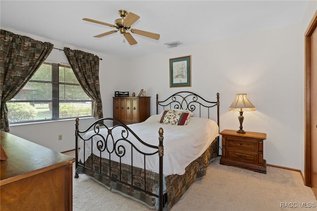 bedroom with light colored carpet and ceiling fan