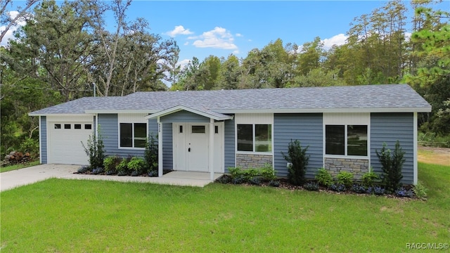 single story home featuring a front yard and a garage