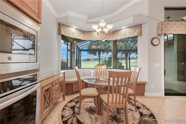 tiled dining room with an inviting chandelier and crown molding