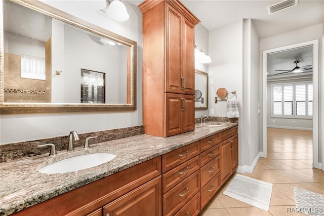 bathroom with ceiling fan, tile patterned floors, and vanity