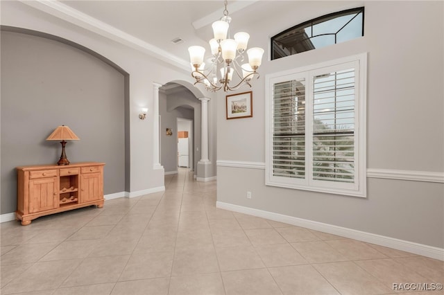 interior space with a chandelier and light tile patterned floors