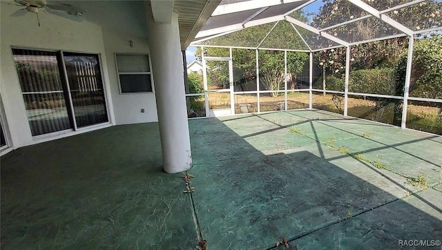 view of patio / terrace featuring glass enclosure and ceiling fan