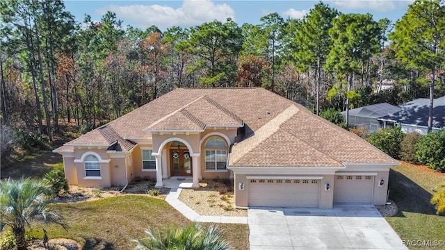 view of front of home with a garage and a front yard