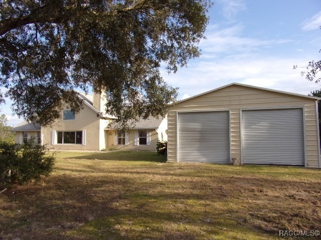 exterior space featuring an outdoor structure and a garage