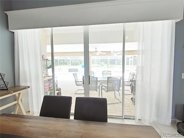 dining room with light tile patterned floors and ceiling fan