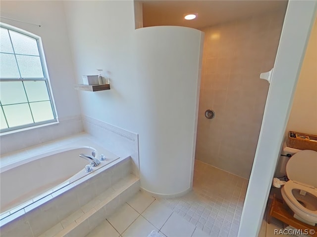 bathroom with tile patterned floors, separate shower and tub, and toilet