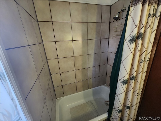 bathroom featuring shower / bath combination with curtain