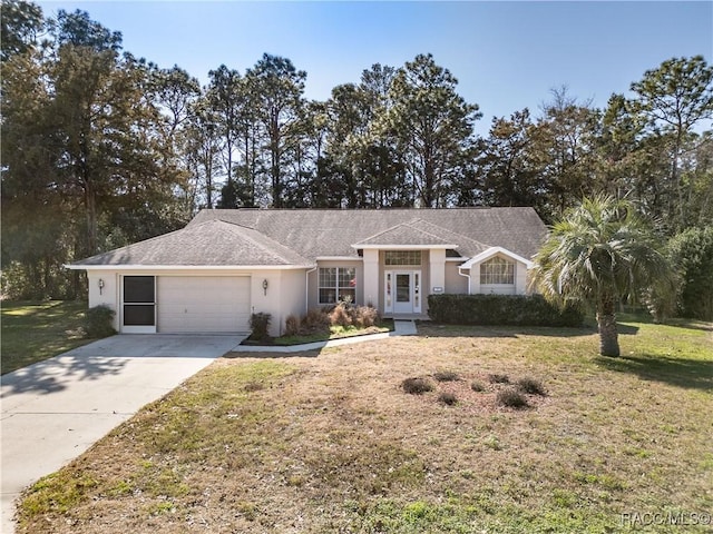 ranch-style home with a garage and a front yard