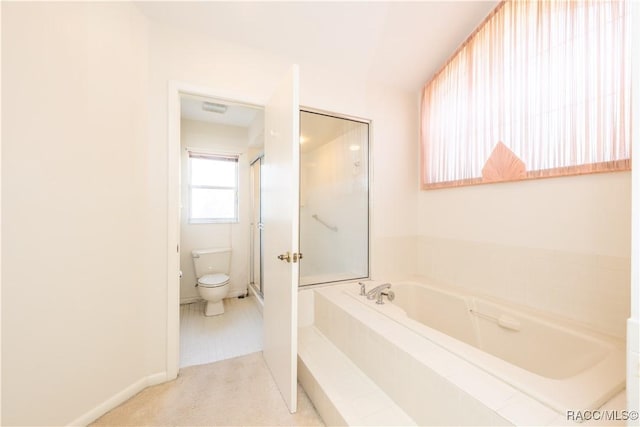 bathroom with toilet and separate shower and tub