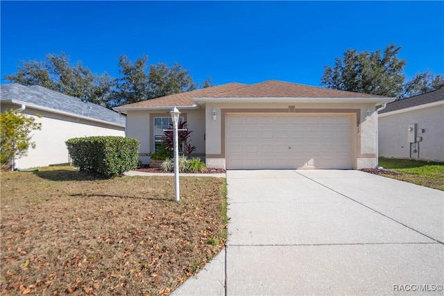 ranch-style house featuring a garage and a front yard