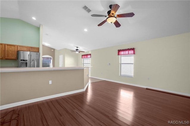 unfurnished living room with vaulted ceiling, ceiling fan, and dark hardwood / wood-style flooring