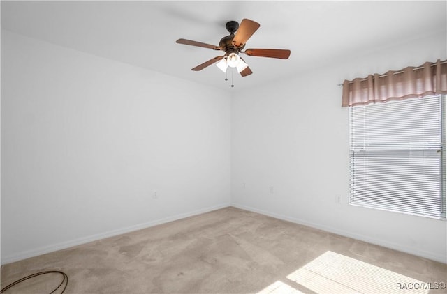 unfurnished room with light carpet and ceiling fan