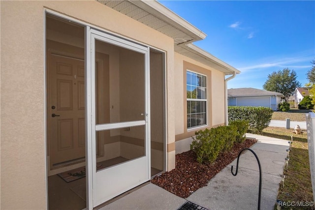 property entrance with a patio