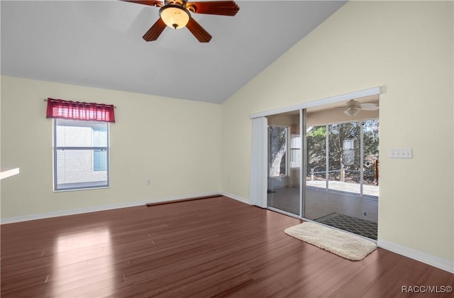 unfurnished room featuring ceiling fan, dark wood-type flooring, and a wealth of natural light