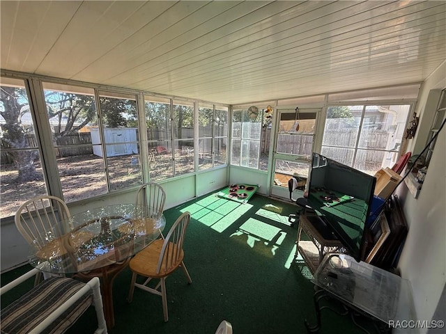 sunroom / solarium featuring wood ceiling