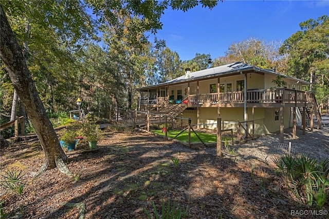 back of property with stairway