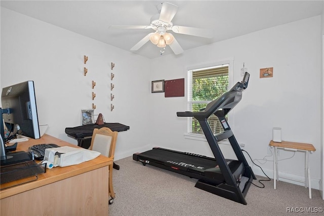 workout area with ceiling fan and light colored carpet