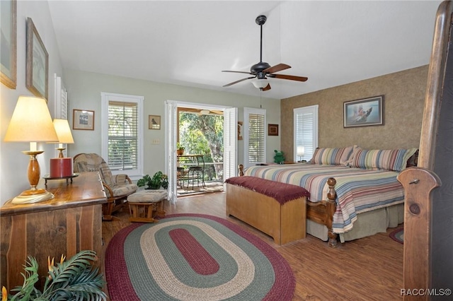 bedroom with access to exterior, ceiling fan, and wood finished floors