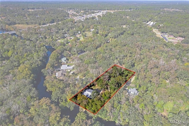 bird's eye view featuring a wooded view