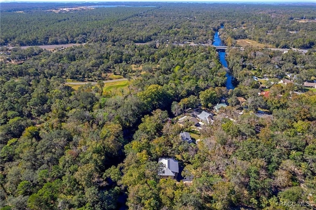 aerial view featuring a wooded view