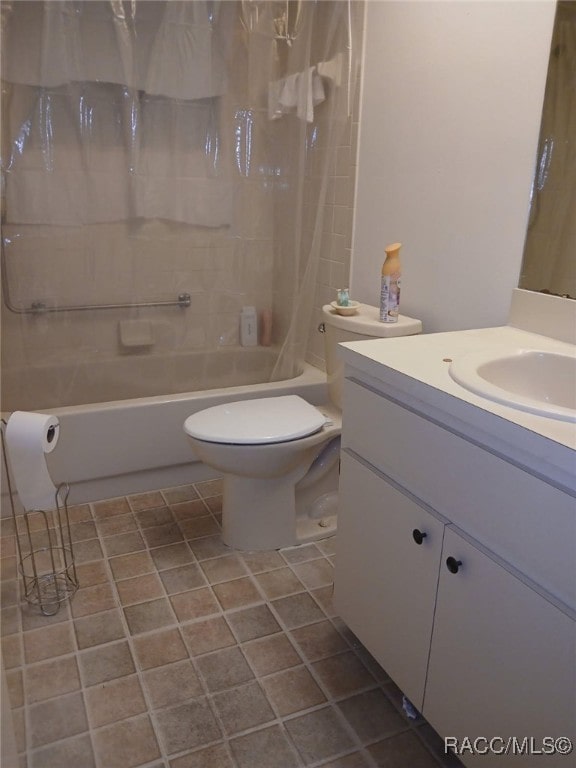 bathroom with shower / bath combination with curtain, tile patterned floors, vanity, and toilet