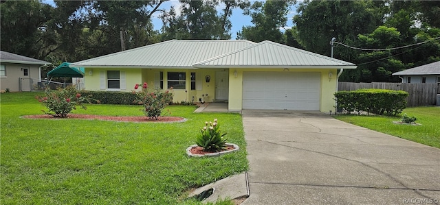 ranch-style home with a front yard and a garage