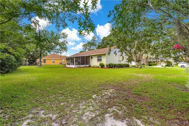 4325 NE 33rd Ave, Ocala, FL 34479 - view of grassy yard featuring a sunroom