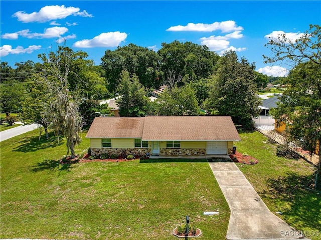 4325 NE 33rd Ave, Ocala, FL 34479 - view of front of property with a front yard, driveway, a garage, and a chimney