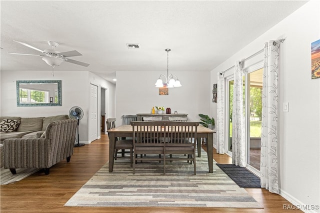4325 NE 33rd Ave, Ocala, FL 34479 - dining space featuring wood finished floors, a chandelier, and a ceiling fan