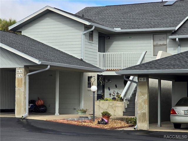 entrance to property with a balcony and a carport