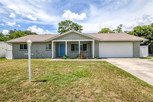 ranch-style house with a front yard and a garage