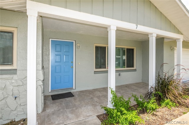 doorway to property featuring a porch