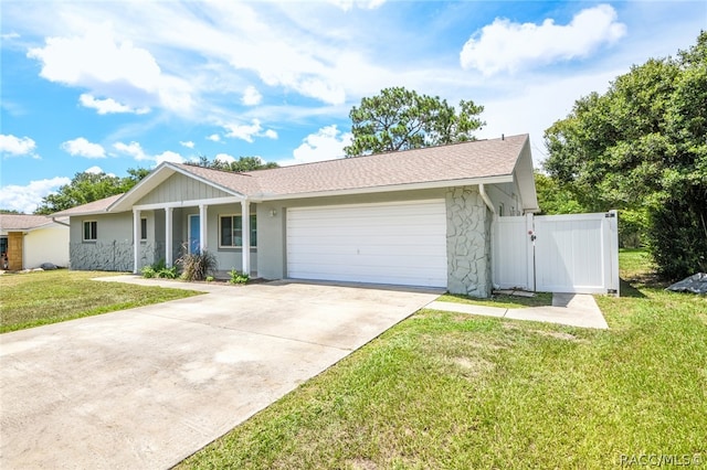 single story home featuring a garage and a front lawn