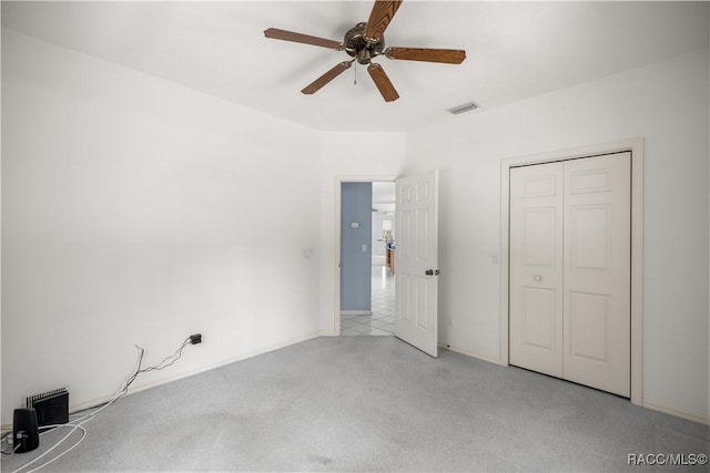 5725 N Durango Ter, Beverly Hills, FL 34465 - unfurnished bedroom featuring light colored carpet, ceiling fan, and a closet