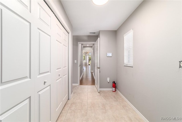 23 W Mickey Mantle Path, Hernando, FL 34442 - hallway with light tile patterned flooring and baseboards