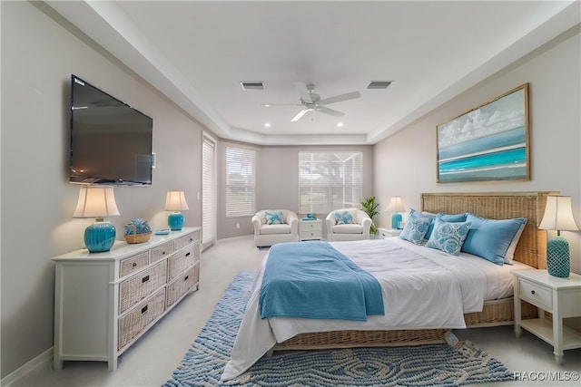bedroom featuring baseboards, ceiling fan, a raised ceiling, light colored carpet, and recessed lighting