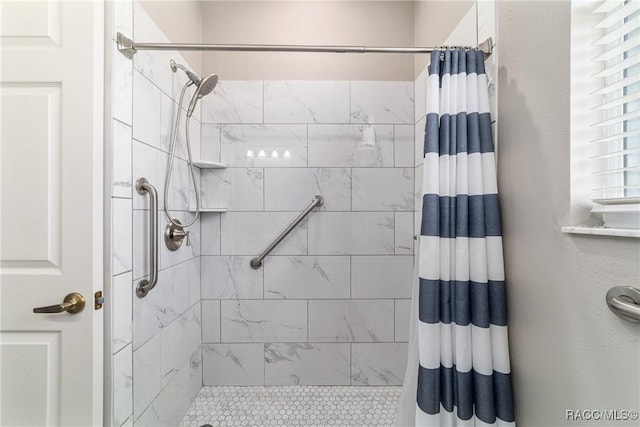 full bath with a shower stall and radiator