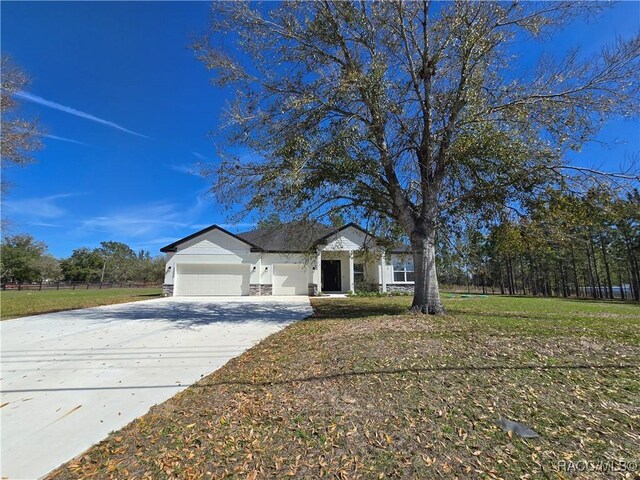 2645 N Annapolis Ave, Hernando, FL 34442 - single story home with a garage, concrete driveway, and a front lawn