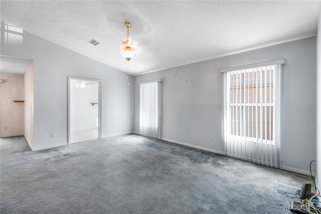 unfurnished room with carpet flooring, a textured ceiling, ceiling fan, and lofted ceiling