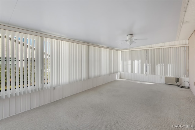 unfurnished sunroom with ceiling fan