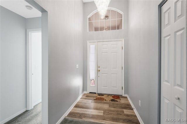 entrance foyer with a chandelier and light hardwood / wood-style floors