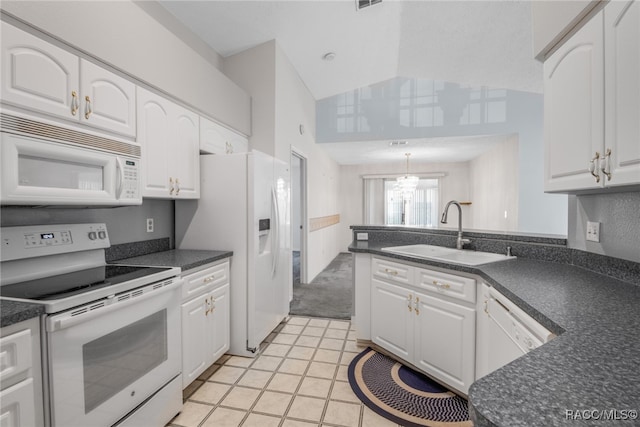 kitchen with white appliances, high vaulted ceiling, sink, light tile patterned floors, and white cabinetry