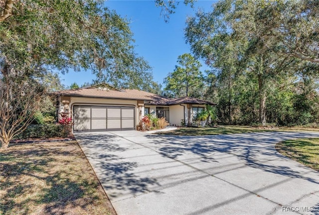 single story home featuring a garage