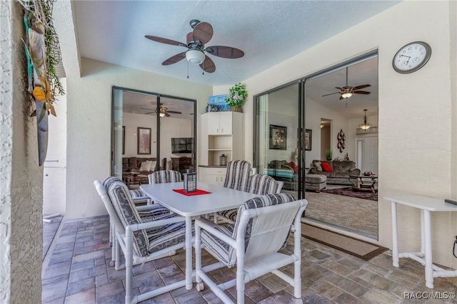 dining space with a textured ceiling