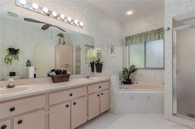 bathroom featuring tile patterned floors, vanity, and shower with separate bathtub