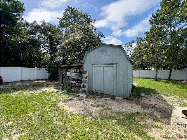 view of outdoor structure with a lawn