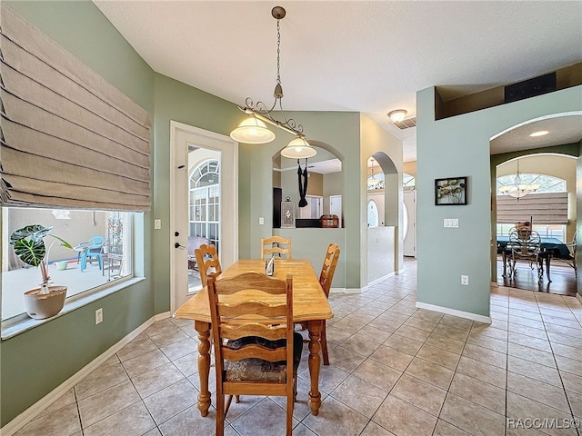 dining room featuring a healthy amount of sunlight and light tile patterned floors