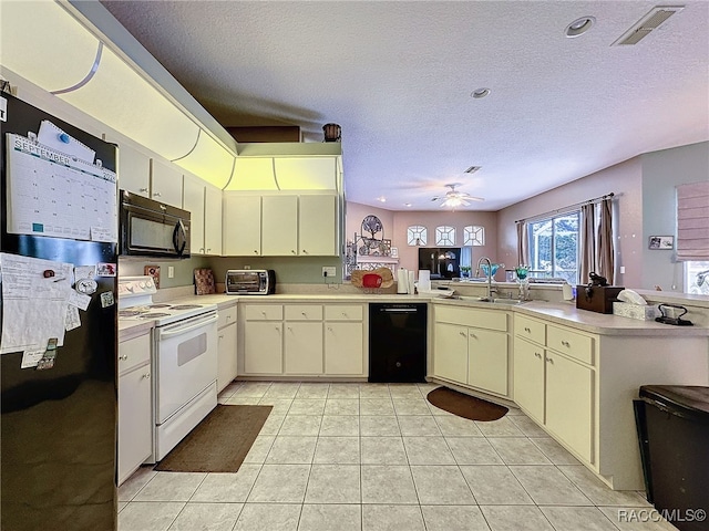 kitchen with ceiling fan, kitchen peninsula, cream cabinets, a textured ceiling, and black appliances